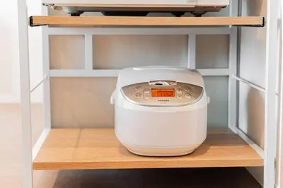 a kitchen appliance sitting on a shelf in a cabinet at saiei hotel 301 in Tokyo