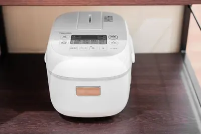 a white computer printer sitting on a table at saiei hotel 302 in Tokyo