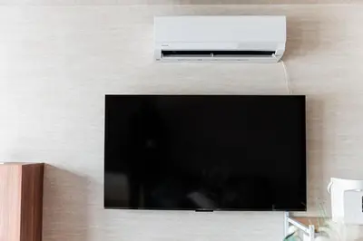 a flat screen tv hanging on a wall at saiei hotel 501 in Tokyo