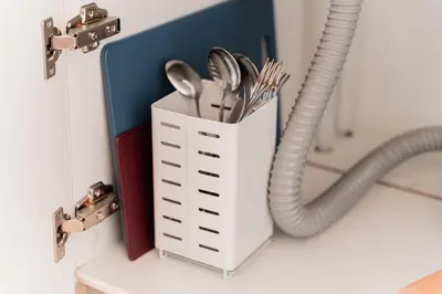 a white holder with utensils and a hose at saiei hotel 501 in Tokyo