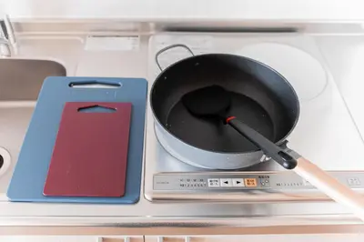 a pan sitting on top of a stove with a tablet at saiei hotel 501 in Tokyo
