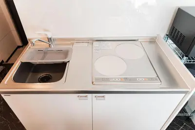 a small kitchen with a sink and a counter at saiei hotel 502 in Tokyo