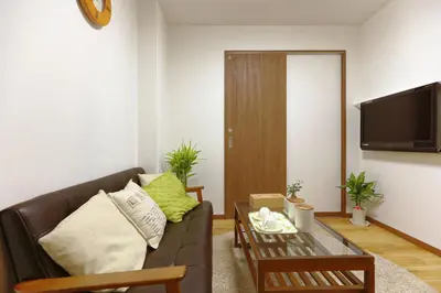 a living room with a couch and a table at Okubo 106-SJ0020 in Tokyo