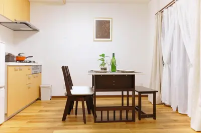 a kitchen with a table and chairs in a room at Okubo 106-SJ0020 in Tokyo