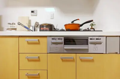 a kitchen with a stove and a microwave at Okubo 106-SJ0020 in Tokyo
