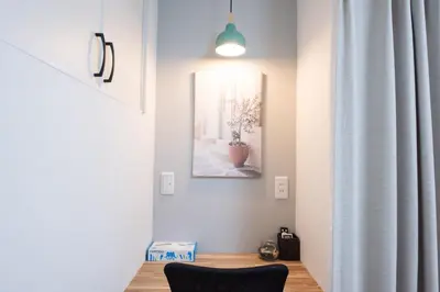 a room with a chair and a picture on the wall at First Look House-SM0028 in Tokyo