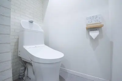 a bathroom with a white toilet in a white wall at First Look House-SM0028 in Tokyo