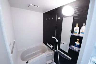 a bathroom with a sink and a bath tub at First Look House-SM0028 in Tokyo