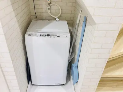 a white washer and dryer in a small room at First Look House-SM0028 in Tokyo