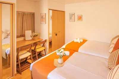 a hotel room with a bed and a desk with a computer at Near Skytree 6-minute walk from Keisei Tokifune, direct access to Airport in Tokyo