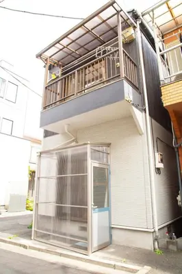 an apartment building with a balcony and a door at Near Skytree 6-minute walk from Keisei Tokifune, direct access to Airport in Tokyo