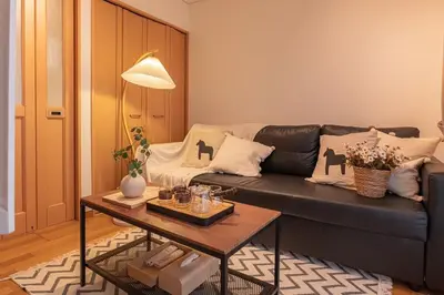 a living room with a couch and a table at Near Skytree 6-minute walk from Keisei Tokifune, direct access to Airport in Tokyo