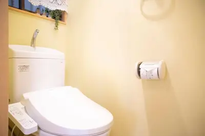 a bathroom with a white toilet in a room at Near Skytree 6-minute walk from Keisei Tokifune, direct access to Airport in Tokyo