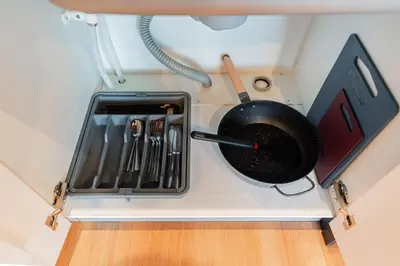 a kitchen counter with a pan and utensils at saiei hotel 201 in Tokyo
