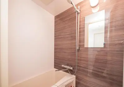 a bathroom with a shower and a toilet and a sink at Kasai Light Luxury Hotel 201 in Tokyo