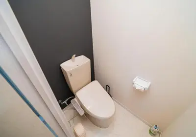 a bathroom with a white toilet in a room at Kasai Light Luxury Hotel 301 in Tokyo
