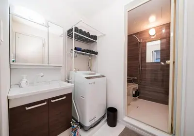 a small kitchen with a sink and a refrigerator at Kasai Light Luxury Hotel 301 in Tokyo