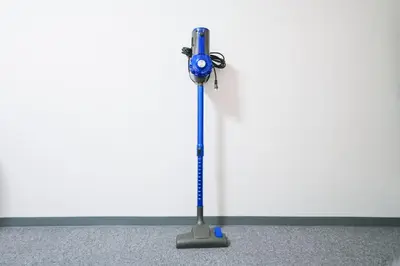 a blue mop in front of a white wall at 4 minutes walk from Shibuya Station 3 beds in Tokyo