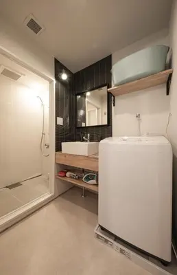a bathroom with a white refrigerator and a sink at The Villa Ebisu BLUE\u60e0\u6bd4\u5bff\u99c5\u5f92\u6b658\u5206 \u9759\u304b\u306a\u4f4f\u5b85\u5730 in Tokyo