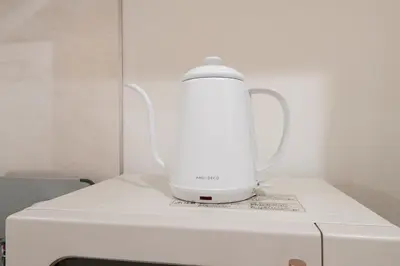 a white blender sitting on top of a white appliance at Urban Villa Sumida in Tokyo