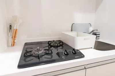 a stove top oven sitting on top of a kitchen counter at Urban Villa Sumida in Tokyo