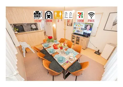 a dining room with a table with chairs and a television at Independent Home - One Minute Walk to Rail Hub - Direct Link to Asakusa Ueno Ginza Tokyo Sky Tower - 102 Square Meters with Four Rooms One Living Area Two Restrooms Two Baths - Easy Link to Both Major Airports in Tokyo