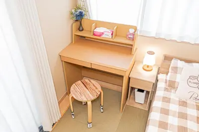 a small bedroom with a desk and a bed at Independent Home - One Minute Walk to Rail Hub - Direct Link to Asakusa Ueno Ginza Tokyo Sky Tower - 102 Square Meters with Four Rooms One Living Area Two Restrooms Two Baths - Easy Link to Both Major Airports in Tokyo