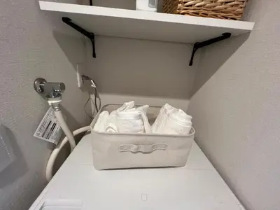 a bag of towels is sitting on a shelf at \u798f\u5c4b\u4e00\u756a\u9928 in Tokyo