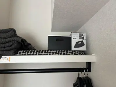 a laptop sitting on a shelf in a room at \u798f\u5c4b\u4e00\u756a\u9928 in Tokyo