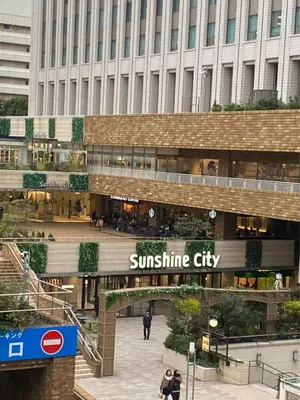 a shopping mall with a suntec city sign in front of a building at \u798f\u5c4b\u4e00\u756a\u9928 in Tokyo