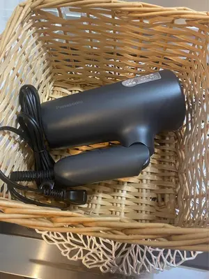 a basket with two hair dryers in it at \u798f\u5c4b\u4e00\u756a\u9928 in Tokyo
