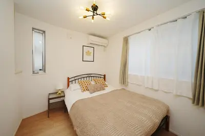 a bedroom with a bed and a window at Near Skytree 90sqm 4BDR! 4mins to station! in Tokyo