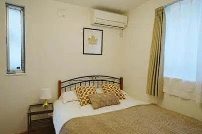 a bedroom with a bed and a window at Near Skytree 90sqm 4BDR! 4mins to station! in Tokyo