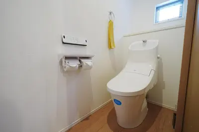 a white toilet in a bathroom with a window at Near Skytree 90sqm 4BDR! 4mins to station! in Tokyo