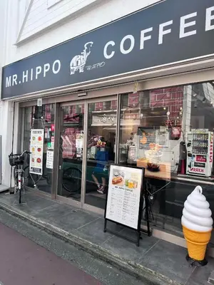 a coffee shop with an ice cream cone in the window at The Yumi Shinjuku in Tokyo