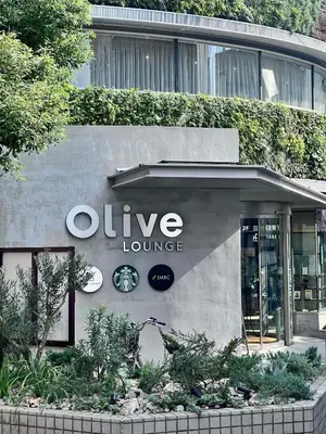 a unique lounge sign on the side of a building at The Yumi Shinjuku in Tokyo