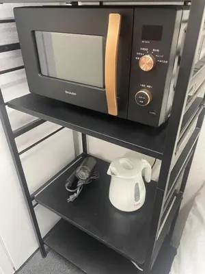 a microwave and a toaster oven on a shelf at SOKOResort Asakusa in Tokyo