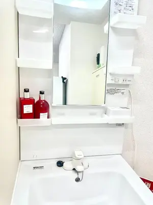 a bathroom with a sink with a mirror and a sink at SOKOResort Asakusa in Tokyo
