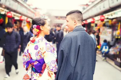 a man and a woman walking in a market at SOKOResort Asakusa in Tokyo