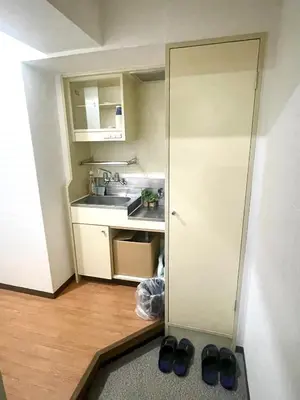 a small kitchen with a sink and a counter at Tokyo West Shinjuku Entire House in Nishishinjuku-gochome in Tokyo