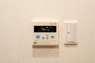 a electronic device with a clock on a wall at Belle Lead in Tokyo