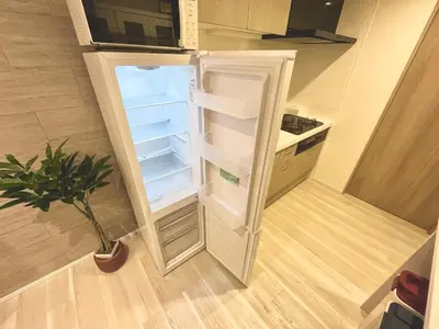 an empty refrigerator with its door open in a kitchen at Terrace Tokyo Skytree in Tokyo