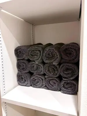 a pile of rolled up towels on a shelf at Terrace Tokyo Skytree in Tokyo