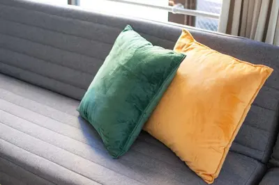 two pillows sitting on top of a couch at Blossom House Akasaka 401 in Tokyo