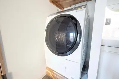 a washer and dryer in a laundry room at Blossom House Akasaka 401 in Tokyo