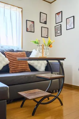 a living room with a couch with a table at JR ChuoLine Aasagaya station 5min,Shinjuku 8min Max15pp 2WC in Tokyo