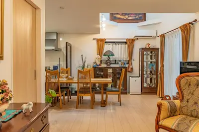a living room with a dining room table and chairs at 3 minutes walk to the station, direct to Ikebukuro, two-story house with a garden in Tokyo