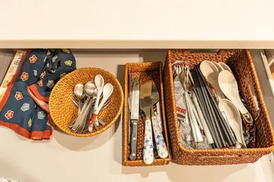 three baskets of utensils are hanging on a shelf at 3 minutes walk to the station, direct to Ikebukuro, two-story house with a garden in Tokyo