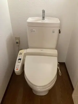 a bathroom with a white toilet with a remote control at AI-Daikannyama 201 in Tokyo