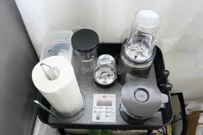 a black shelf with various items on it at Shirokanedai guest suite in Tokyo
